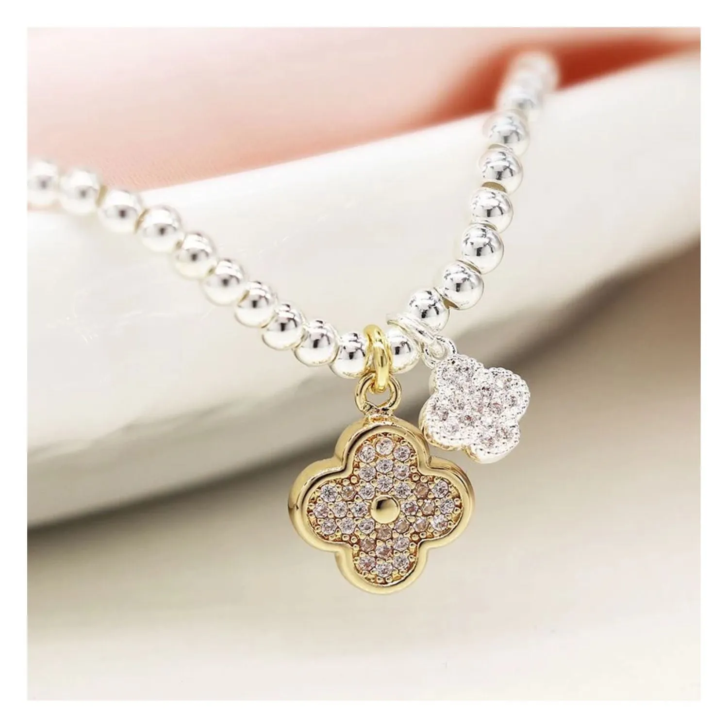 POM Silver Plated Silver Stretch Bracelet with Quatrefoil Gold & Silver Charms